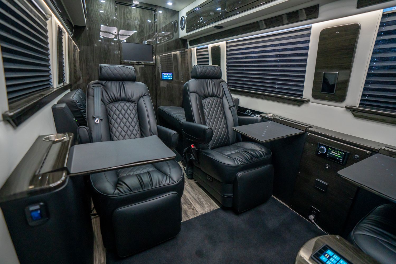 Luxury interior of a modern vehicle with seating.